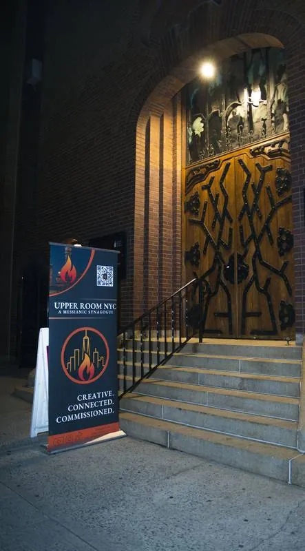 Evening entrance to the Upper Room NYC meeting location in Manhattan